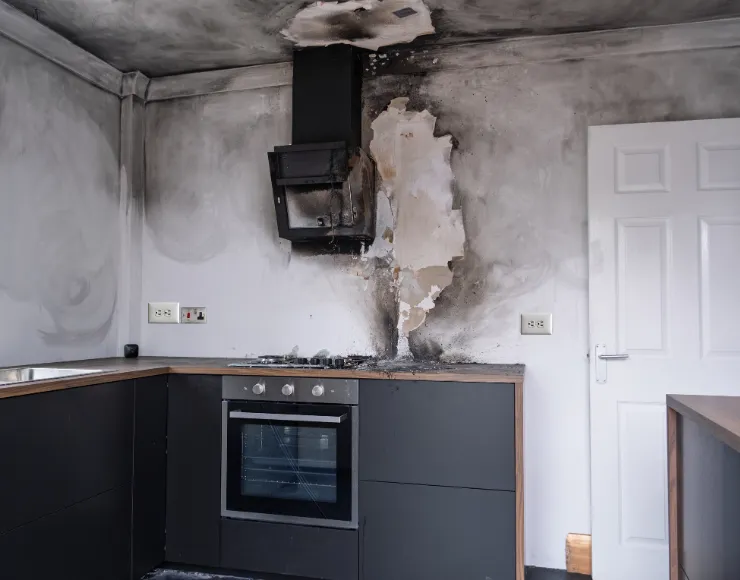 Fire and smoke damage restoration service in Dallas TX showing soot cleanup and structural damage repair after a kitchen fire
