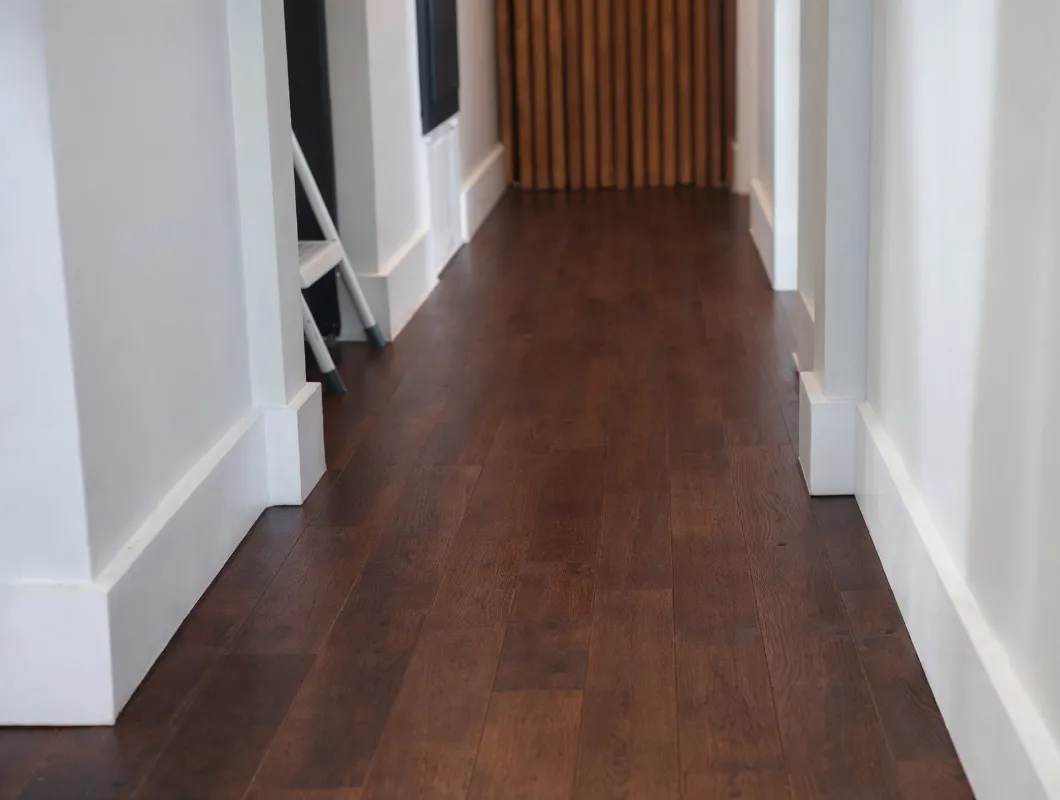 Water damage restoration project in Dallas, Texas, featuring newly repaired hardwood flooring and interior finishes after flood and moisture damage cleanup.