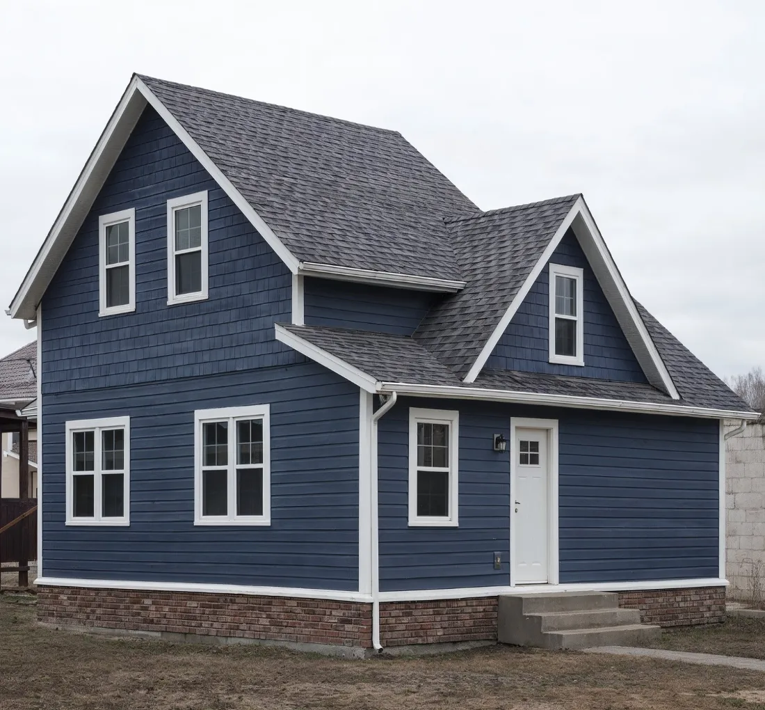 Fully reconstructed two-story home after severe fire damage, rebuilt with modern siding, asphalt shingles, and restored structure by Dallas restoration experts