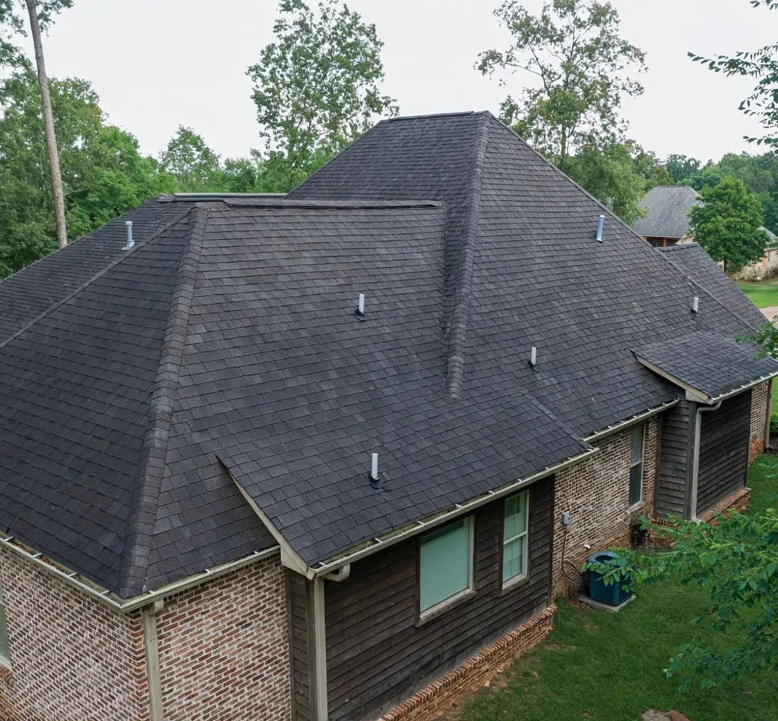Storm and hail damage roof restoration completed on a residential home in Dallas with newly installed asphalt shingles