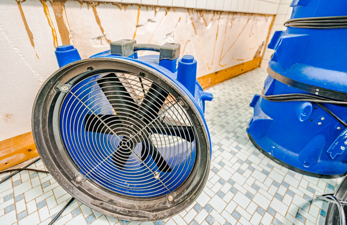 Industrial air mover used for professional water damage drying in a residential property in Dallas